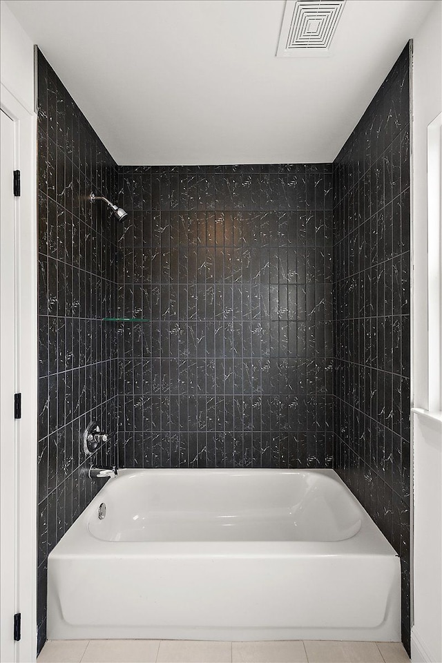 bathroom featuring tub / shower combination, visible vents, and tile patterned floors