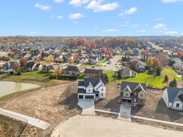 bird's eye view featuring a water view and a residential view