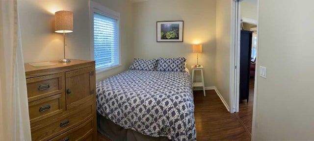 bedroom featuring dark wood-type flooring