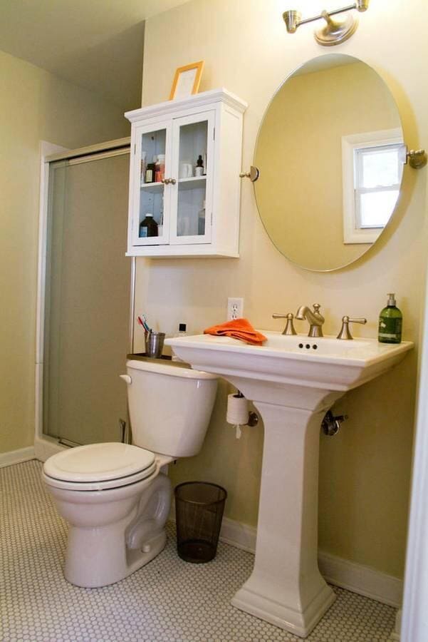 bathroom with toilet, a shower with shower door, and tile patterned floors