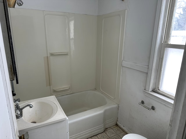 bathroom featuring sink and a wealth of natural light