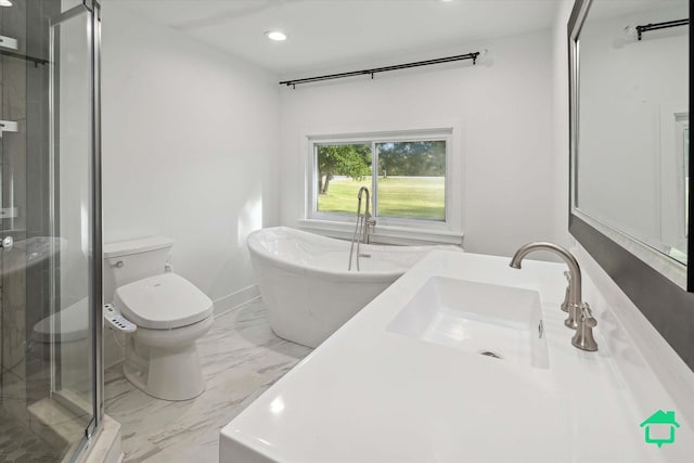 full bathroom with a freestanding tub, toilet, recessed lighting, a sink, and marble finish floor