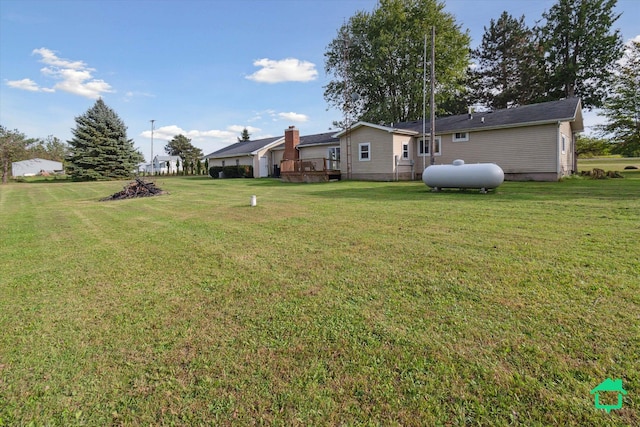 view of yard featuring a wooden deck