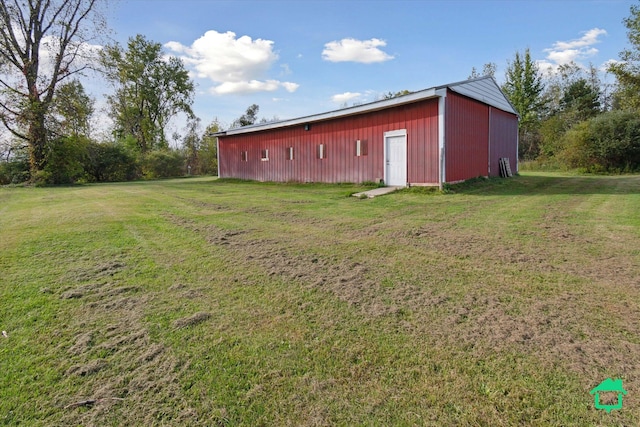 view of pole building with a lawn