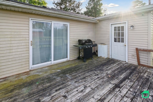 wooden terrace featuring grilling area