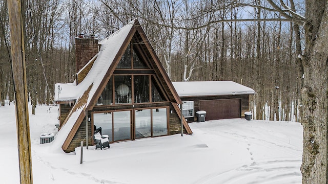 exterior space featuring central AC and a garage