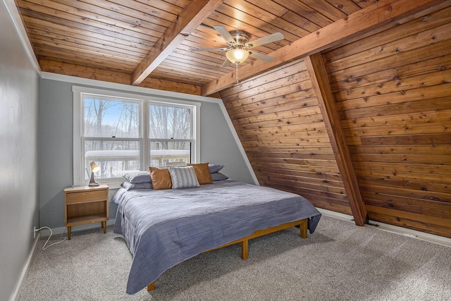 carpeted bedroom with ceiling fan, vaulted ceiling with beams, and wooden ceiling