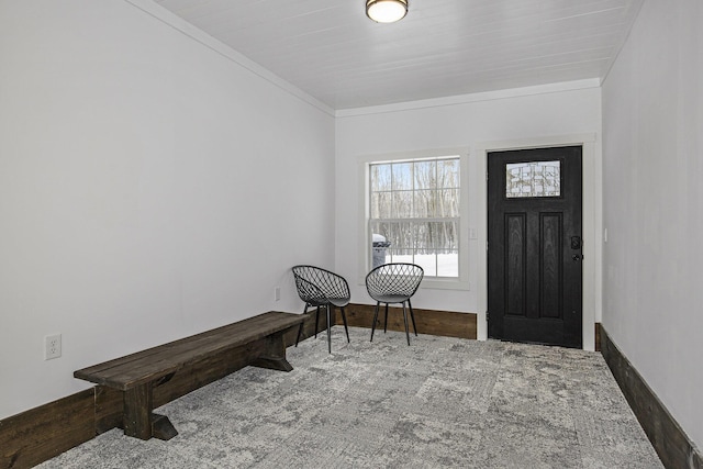 foyer featuring ornamental molding