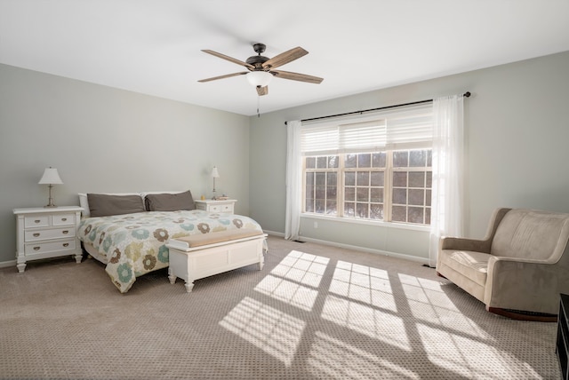 bedroom featuring light carpet and ceiling fan