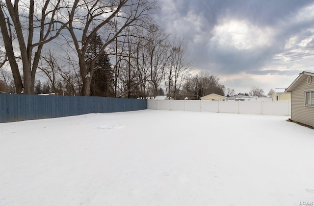 view of yard covered in snow