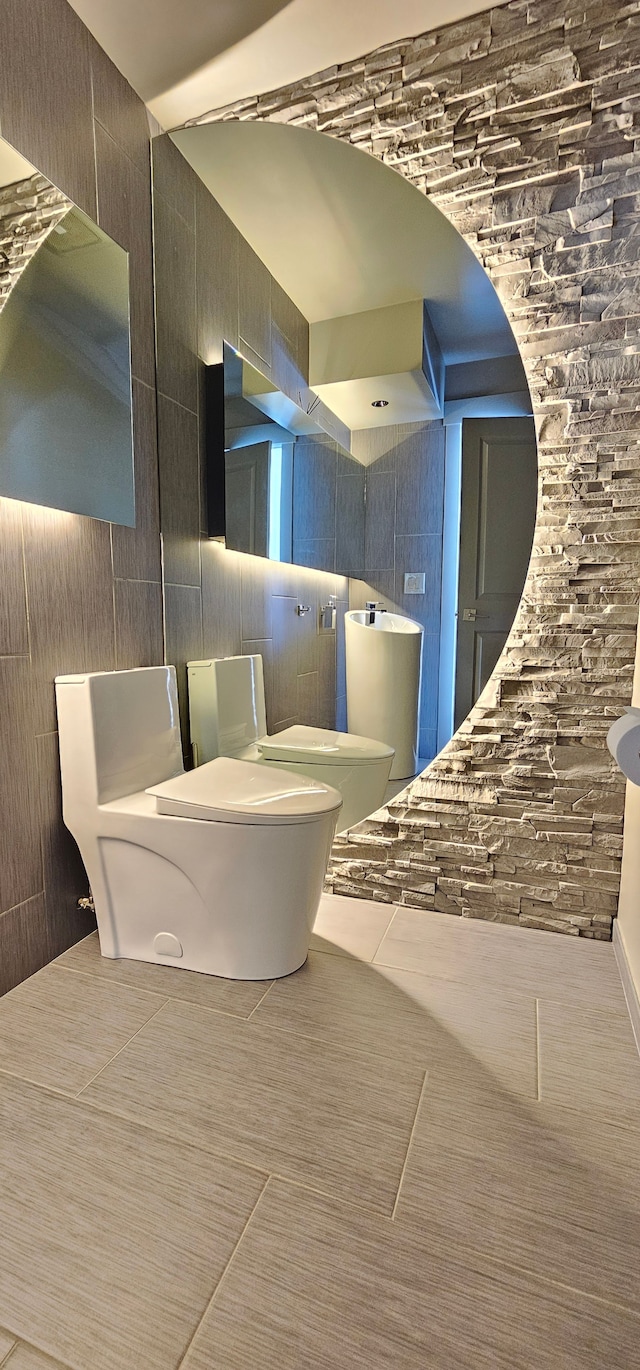 bathroom featuring tile patterned flooring and toilet