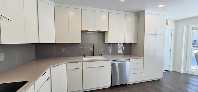 kitchen with white cabinetry, dark hardwood / wood-style flooring, sink, dishwasher, and decorative backsplash