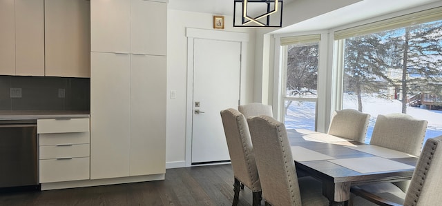 dining area with dark hardwood / wood-style floors