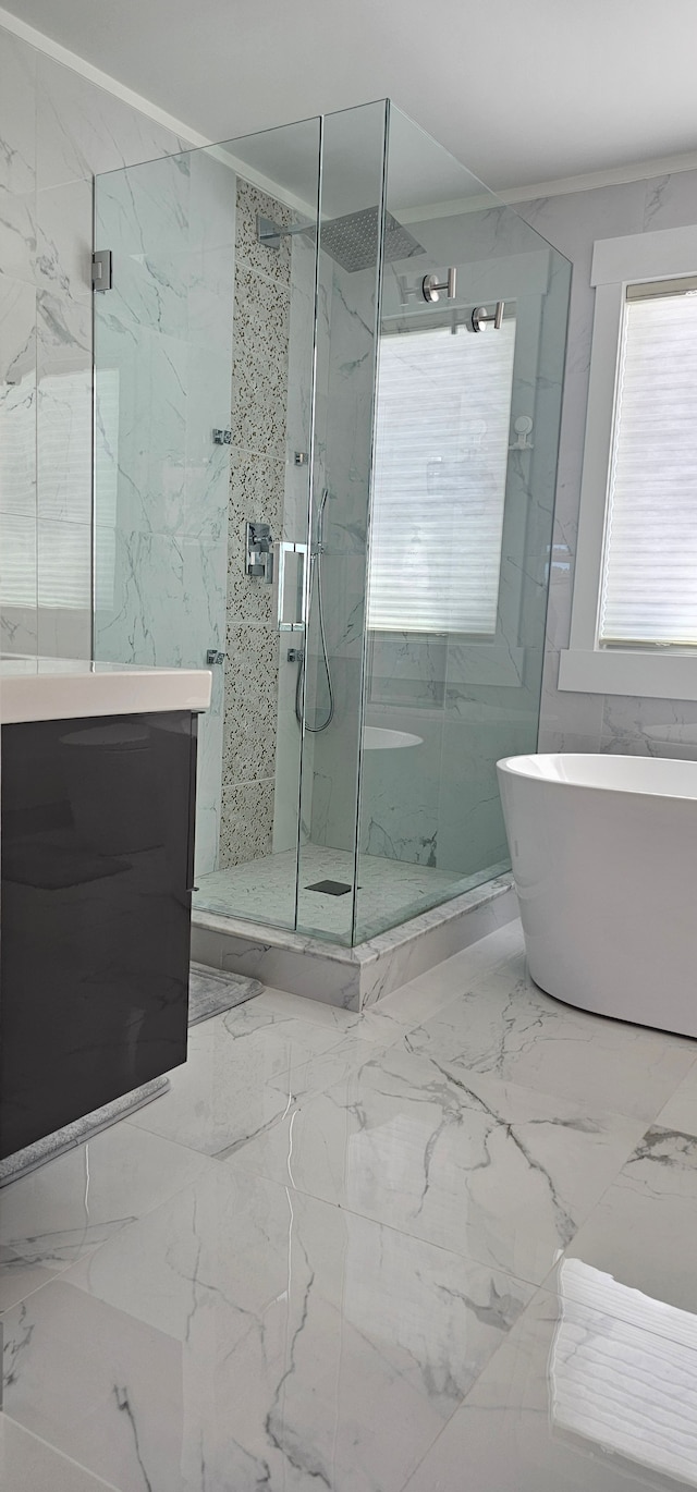 bathroom featuring ornamental molding, vanity, and plus walk in shower