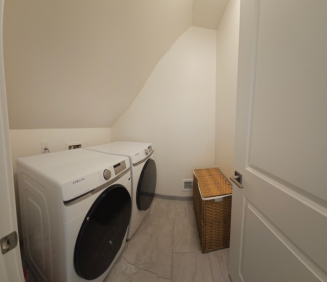 washroom with separate washer and dryer