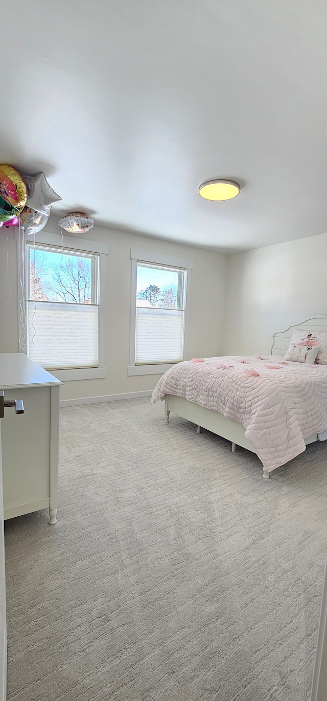 unfurnished bedroom featuring light colored carpet