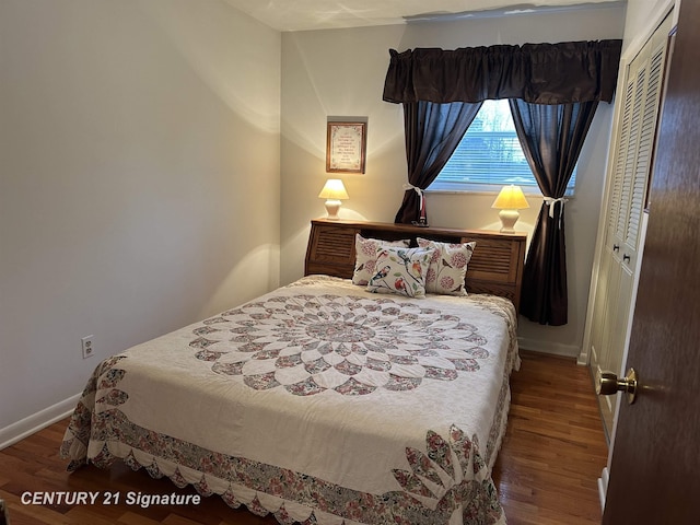 bedroom featuring hardwood / wood-style flooring and a closet