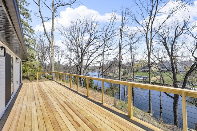 10781 Woodbrook Dr, Cement City, MI 49233 - wooden deck featuring a water view