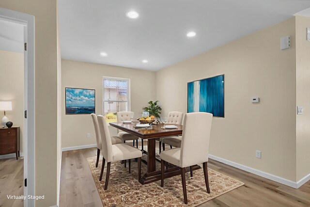 10781 Woodbrook Dr, Cement City, MI 49233 - dining area with light wood-style flooring and recessed lighting