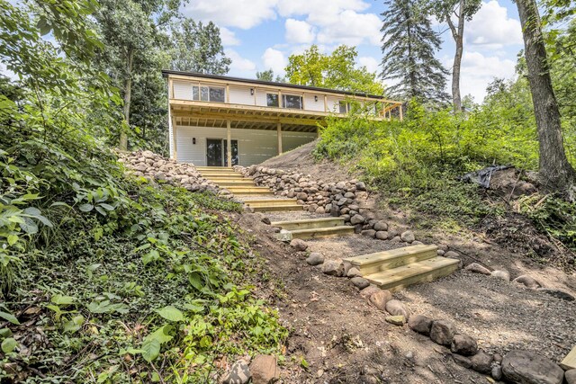 10781 Woodbrook Dr, Cement City, MI 49233 - rear view of property with stairs