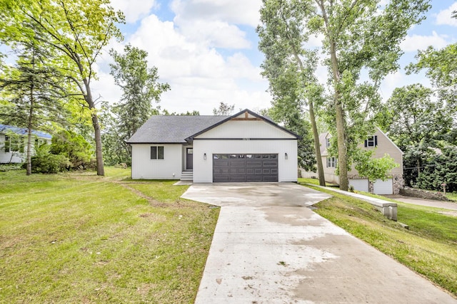 10781 Woodbrook Dr, Cement City, MI 49233 - view of front facade featuring concrete driveway and a front yard