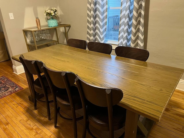 dining space featuring hardwood / wood-style floors