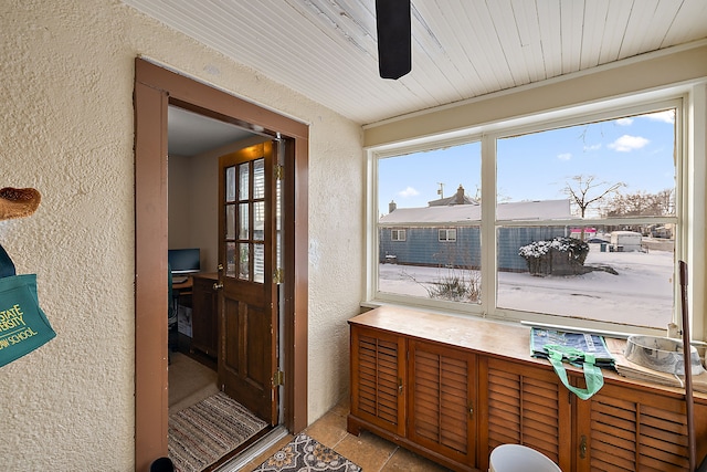 sunroom / solarium featuring wooden ceiling