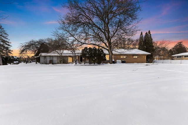 view of yard layered in snow