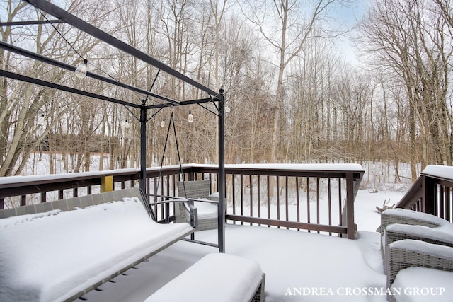 view of snow covered deck