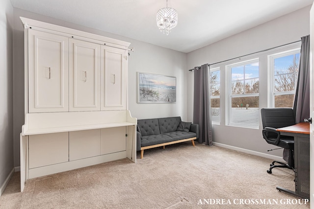 office space with a chandelier and light colored carpet