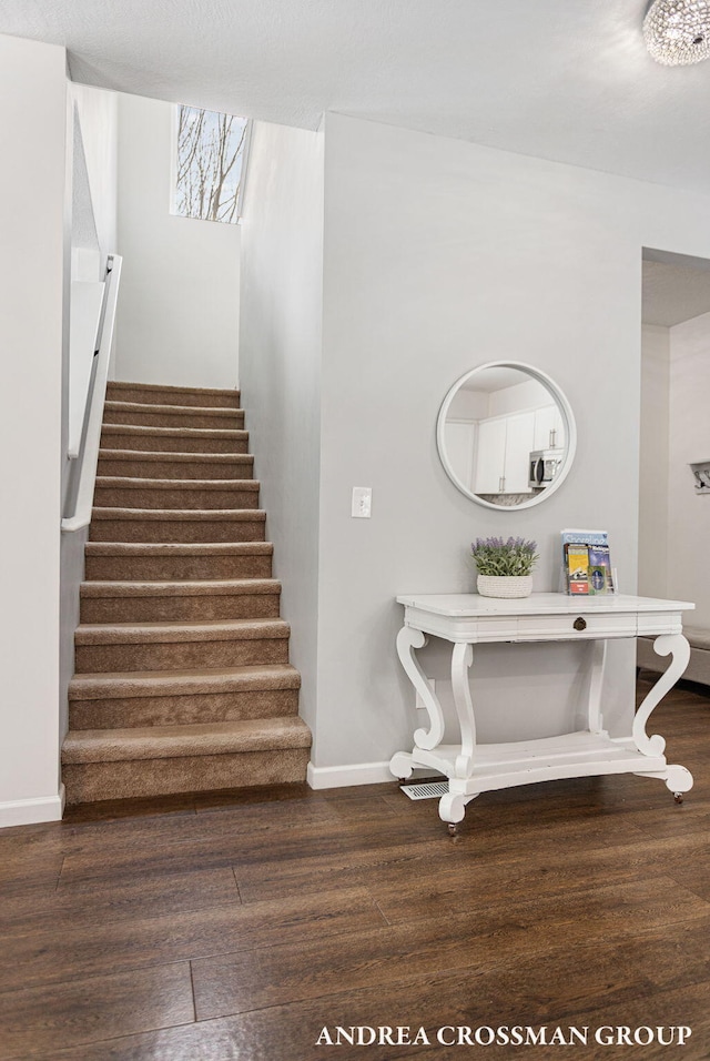 staircase featuring hardwood / wood-style flooring