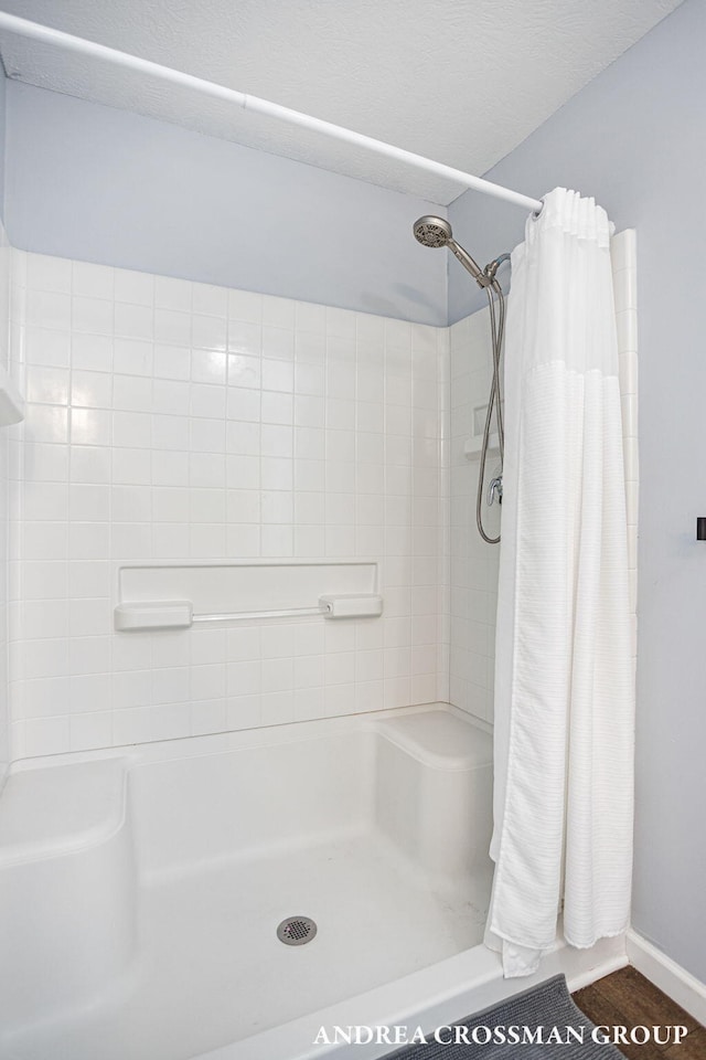 bathroom with a shower with shower curtain