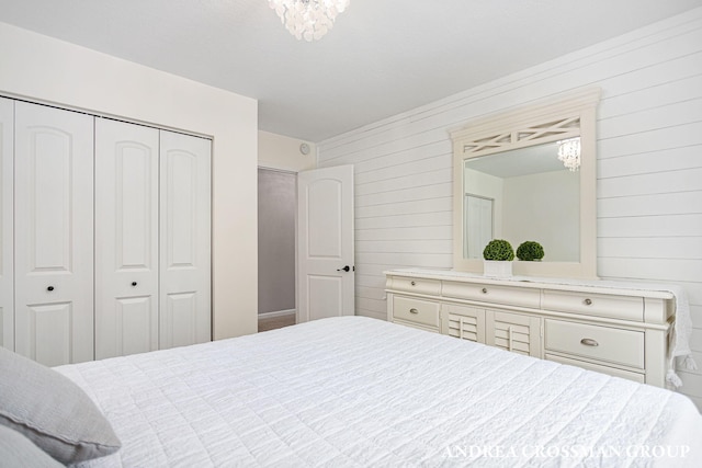 bedroom featuring a closet and a chandelier