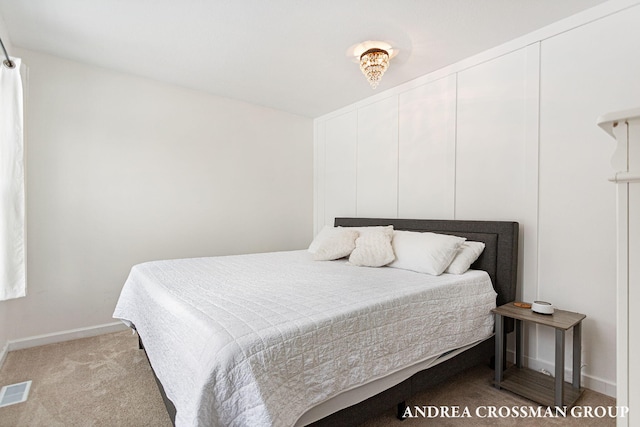 bedroom with light colored carpet