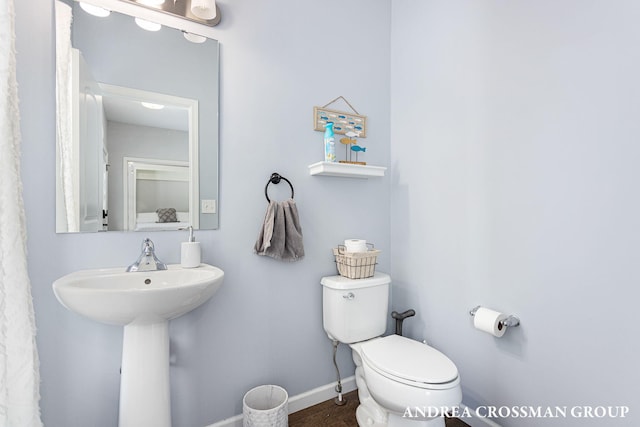 bathroom with sink and toilet