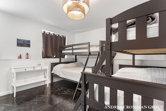 bedroom with a notable chandelier