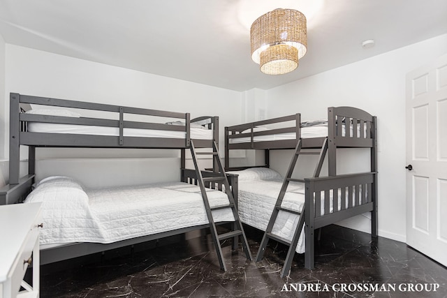 bedroom featuring a notable chandelier