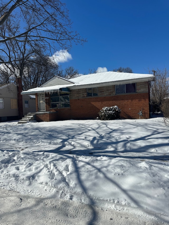 view of snow covered property