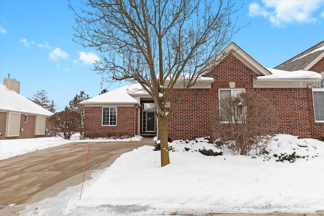 ranch-style house with brick siding