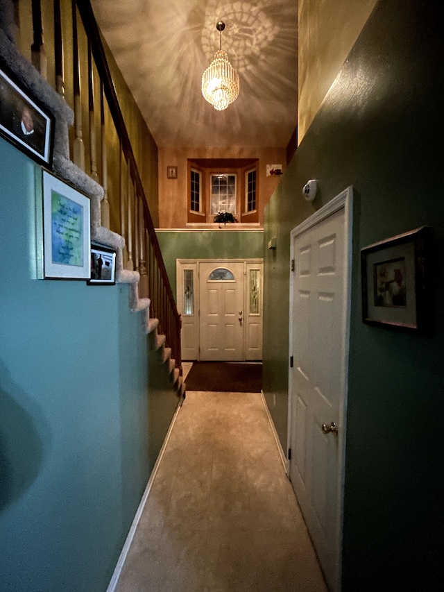 entryway featuring a chandelier