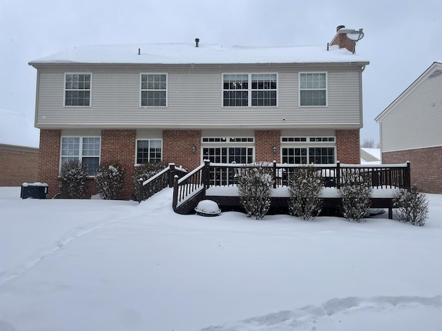 view of snow covered house