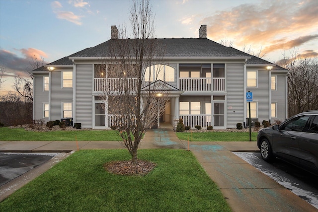 view of outdoor building at dusk