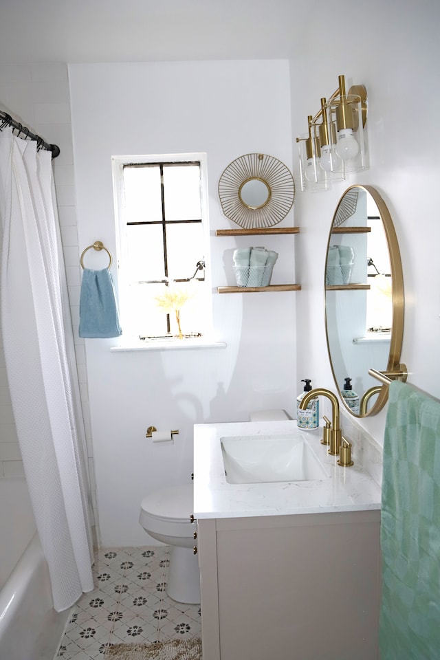 bathroom with toilet, tile patterned floors, shower / bathtub combination with curtain, and vanity