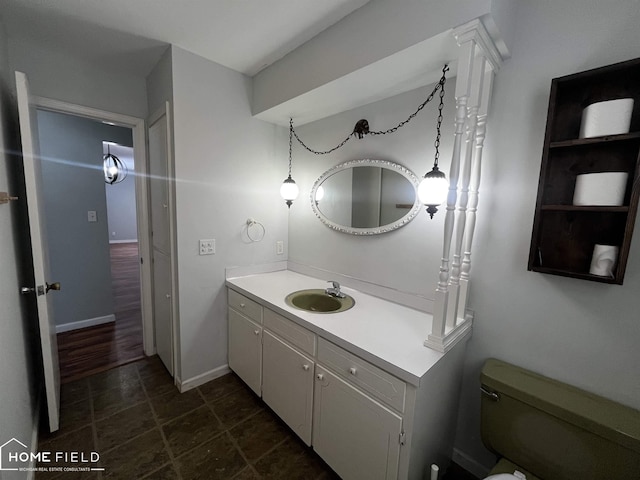 bathroom with toilet and vanity