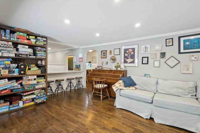 living room with crown molding and dark hardwood / wood-style floors