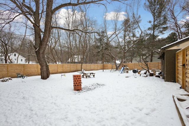 view of yard layered in snow