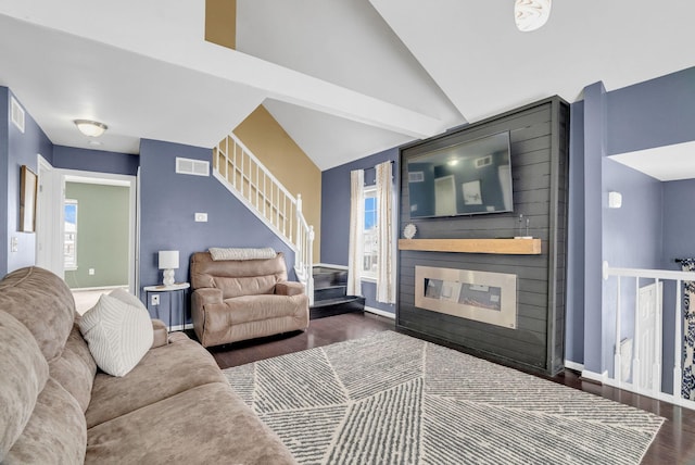 living room with lofted ceiling and dark hardwood / wood-style floors