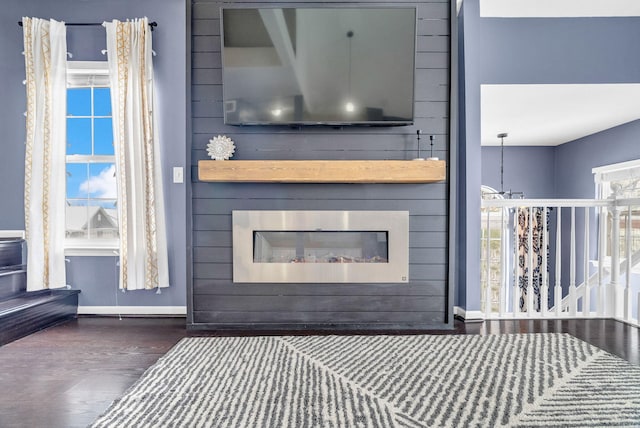 interior space featuring a large fireplace and hardwood / wood-style floors