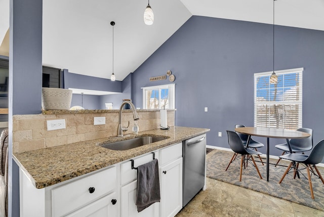 kitchen featuring dishwasher, light stone countertops, white cabinets, decorative light fixtures, and sink