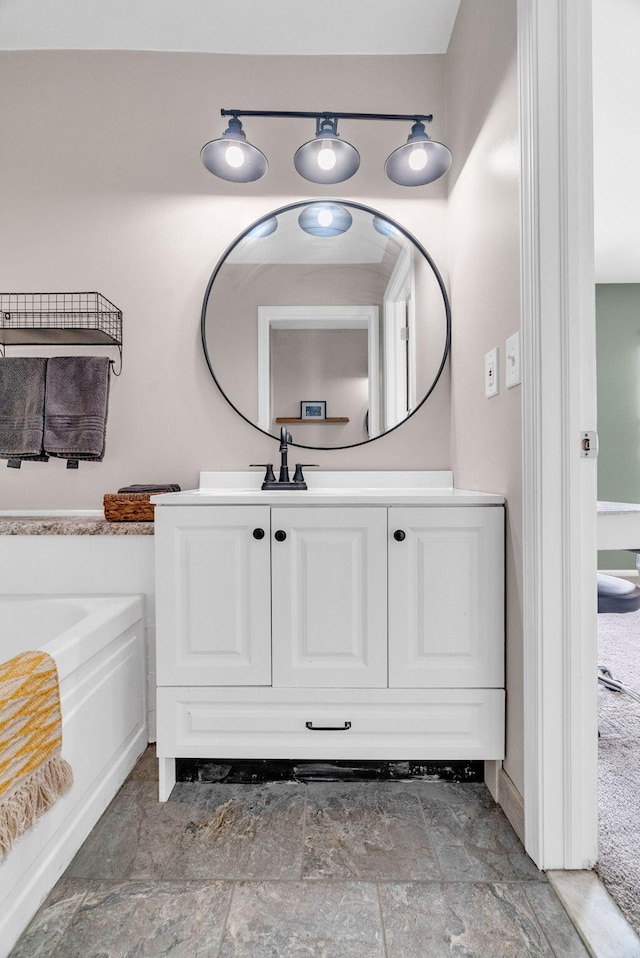 bathroom featuring a tub and vanity